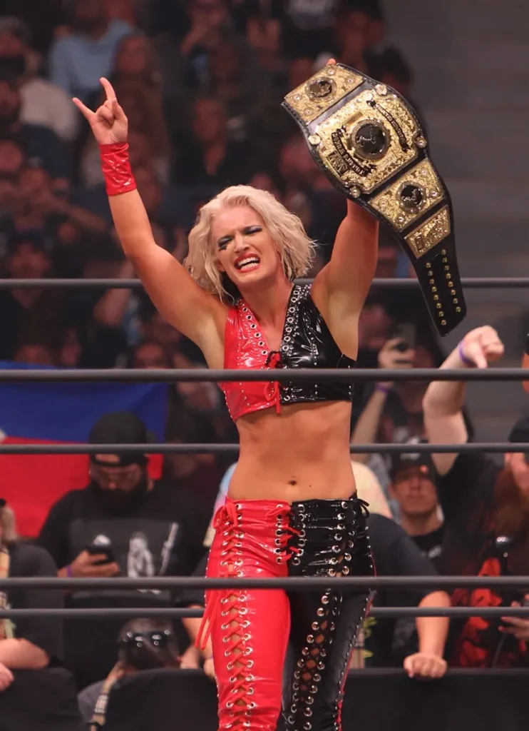 WWE Diva Turned OnlyFans Model named Toni Storm @realtonistorm holding championship belt