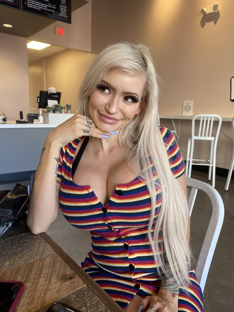 She's a bimbo sister @bimbosister. A bimbo hot blonde asian on onlyfans wearing stripes dress showing big tits.